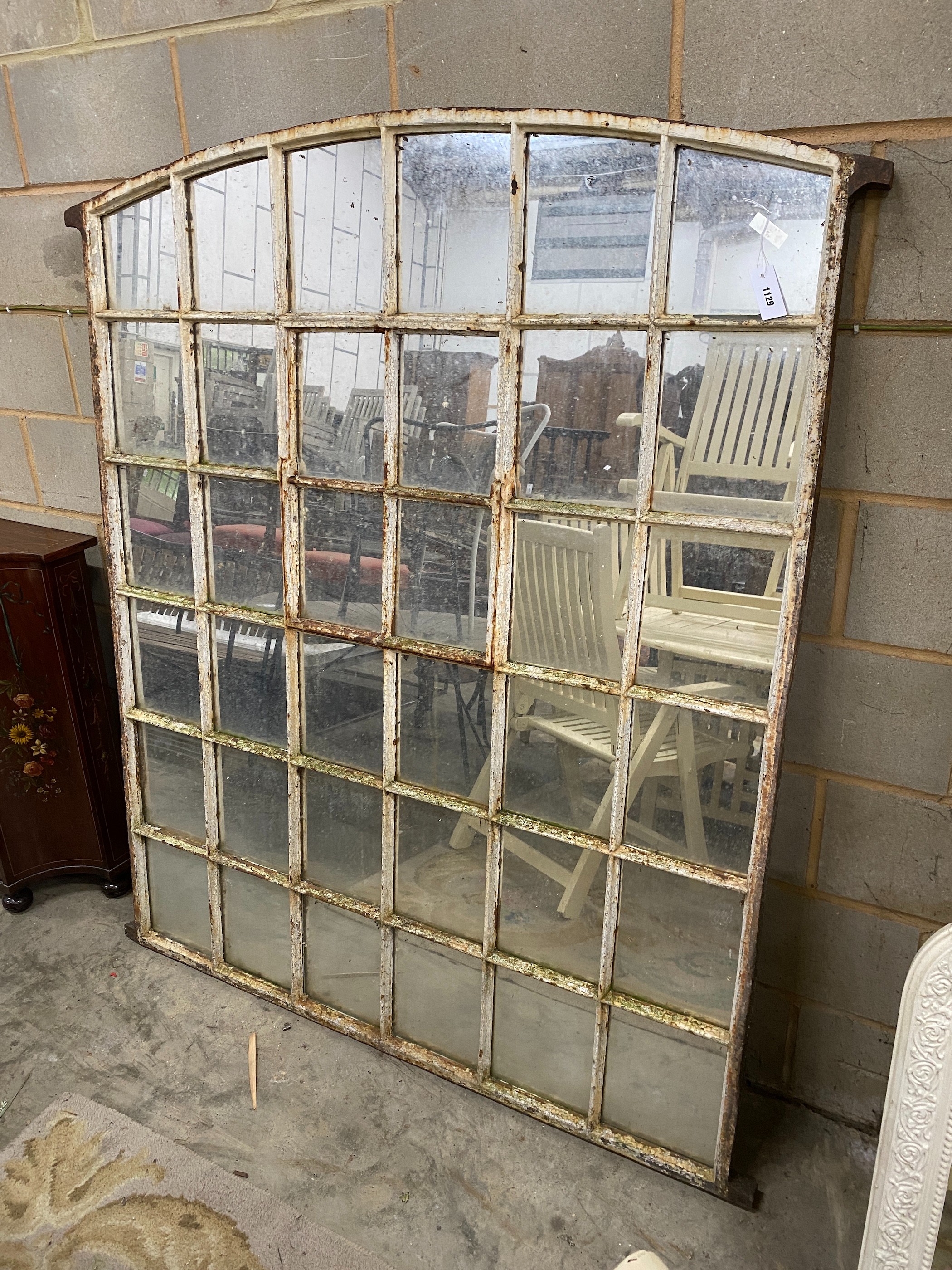 A vintage cast iron window frame wall mirror of arched rectangular form, width 148cm, height 171cm